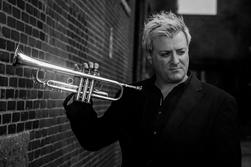Doug Woolverton holding a trumpet