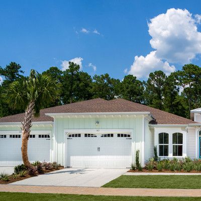 One-storey house with garage and lawn