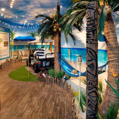 Golf cart and hammock in a beach setting