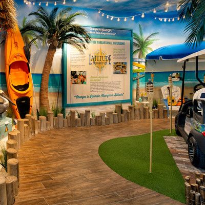 An information board and a kayak in a beach setting