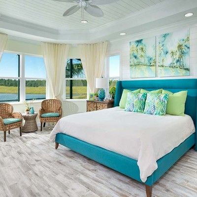 A room with two beds and two windows on one wall