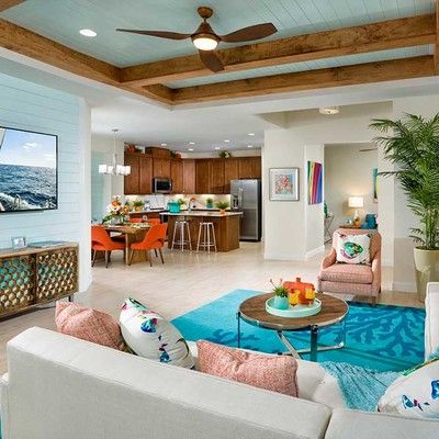 Large living room with sofa, table and an armchair
