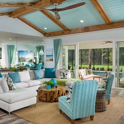 Large living room with sofa and two armchairs