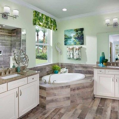 Bathroom with bath and window
