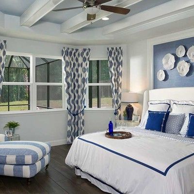 Bedroom with king size bed and large window