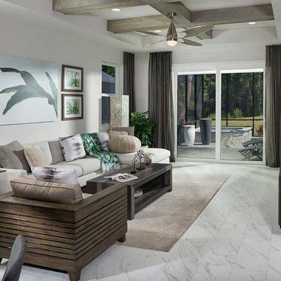 Room with a large sofa and an armchair