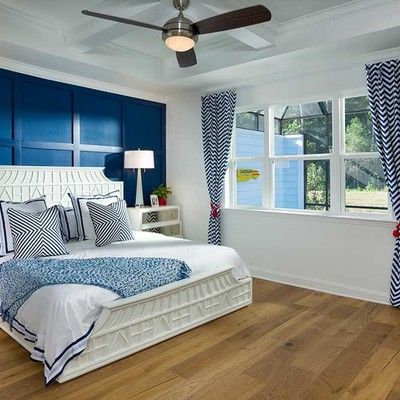 Bedroom with king size bed and large window