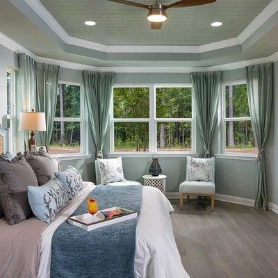 Bedroom with king size bed and large window