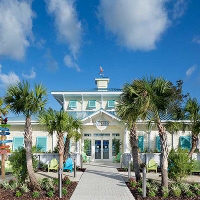 Building with lawn and palm trees