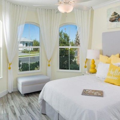 Bedroom with king size bed and two windows