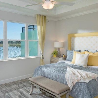 Bedroom with king size bed and large window