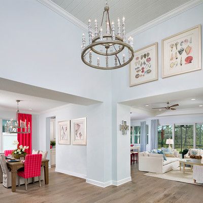 Large room in blue with a large chandelier