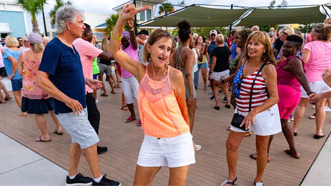 Residents dancing outdoors at Latitude Margaritaville Hilton Head