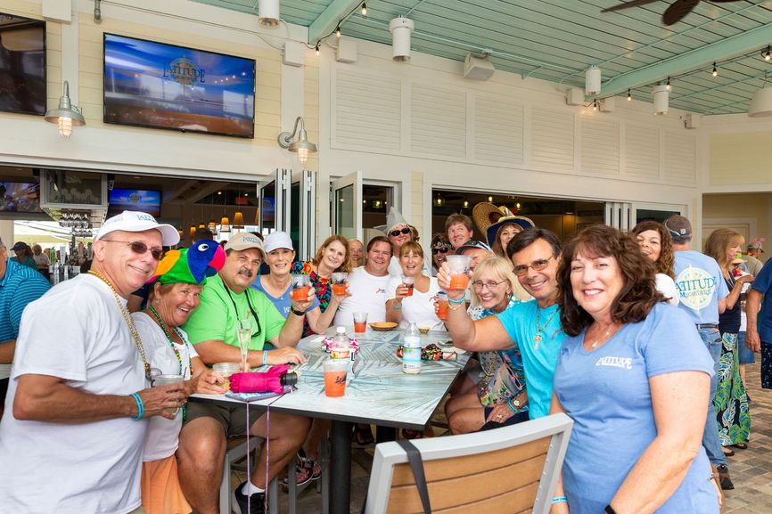 Residents gather around the island-inspired pool, cabanas and refreshment bars