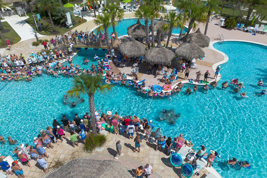 Residents gather around the island-inspired pool, cabanas and refreshment bars