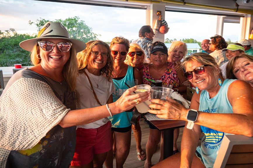 Group of people enjoying a drink at the Latitude Bar & Chill restaurant in Watersound.