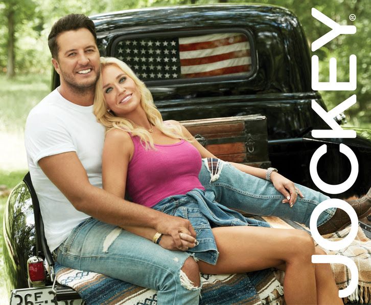 Luke and Caroline Bryan with Jockey logo in back of truck