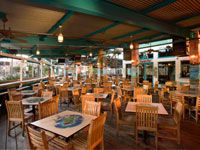 Porch of Indecision Marina Level Interior with tables and chairs
