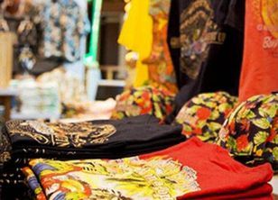T-shirts with margaritaville symbols on the store shelf