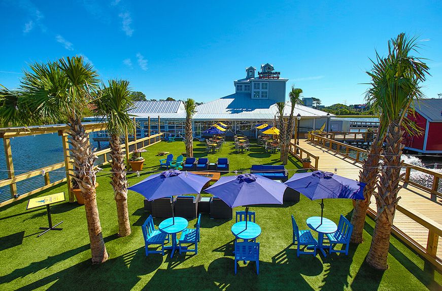 Outdoor patio area surrounded by water