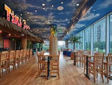 Tiki bar interior with tables and chairs