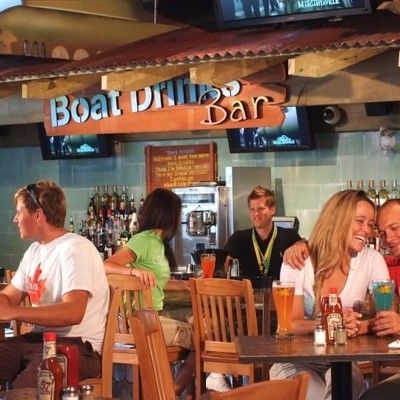 Patrons enjoying food and drinks at the Boat Drinks Bar