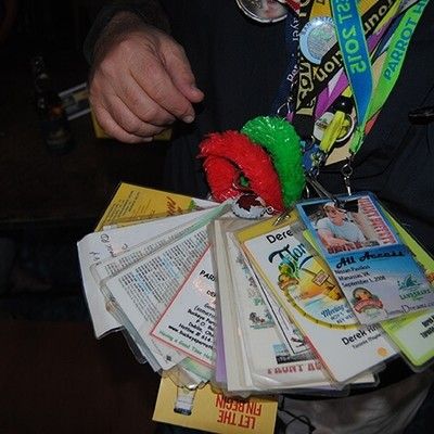 Close-up of event attendee lanyards, passes, and coupons