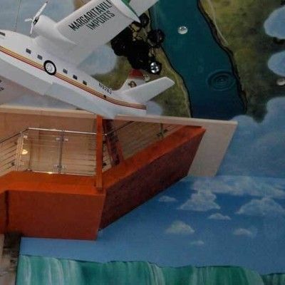 Photo of suspended model airplane decor on the ceiling of Margaritaville