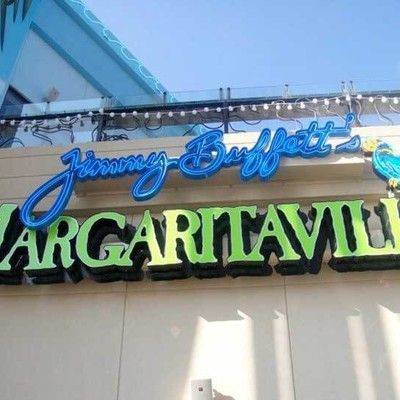 Photo of close-up of the blue Jimmy Buffett's Margaritaville neon sign