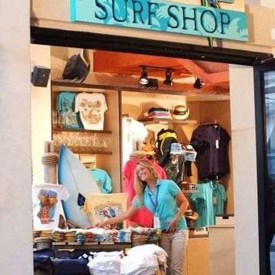 Photo of entrance to the Surf Shop retail store featuring merchandise and apparel