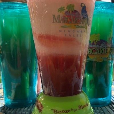 Photo of blended colorful frozen cocktail in a Margaritaville blender cup