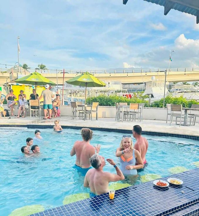 Large group of people inside Margaritaville mingling, drinking and eating