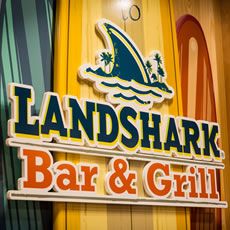 The landshark bar and grill logo on the wall