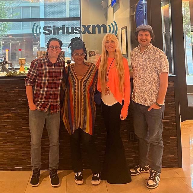 The Radio Margaritaville team standing in front of the studio