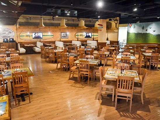 BEACH DINING Interior with tables and chairs