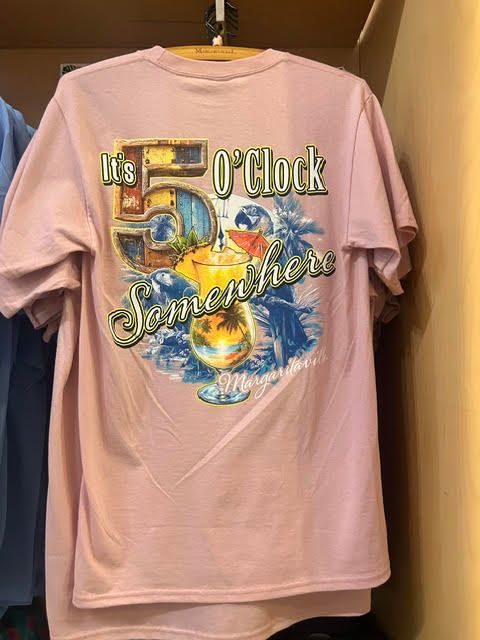 Pink t-shirt reading 'It's 5 O'Clock Somewhere' with a tropical drink graphic