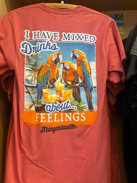 Coral t-shirt featuring two parrots and the text 'I have mixed drinks about feelings'
