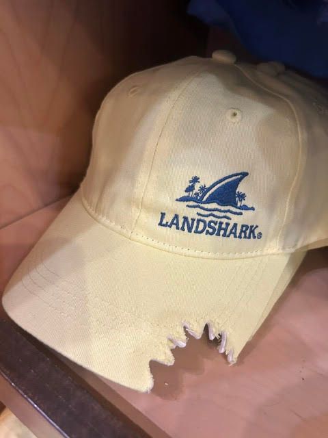 Off-white LandShark baseball cap featuring a shark fin logo and shark bite detail on the brim