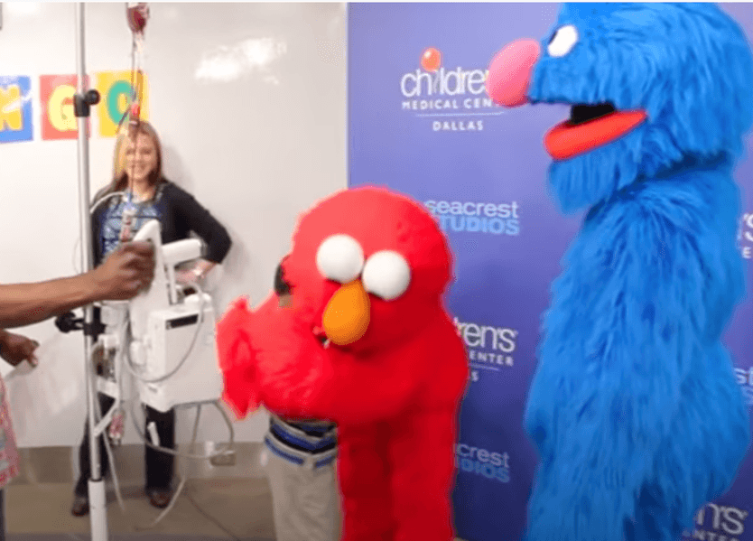 Elmo and Grover Teach Seacrest Studios 'The Elmo Slide!'