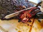 Slicing brisket with a knife 