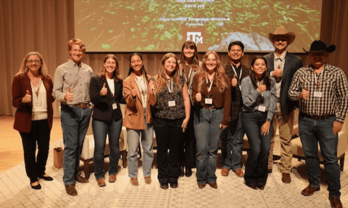 welcoming conservationist, filmmaker and former student