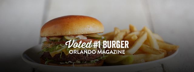 Hamburger and french fries with text: Voted 1 burger, Orlando magazine