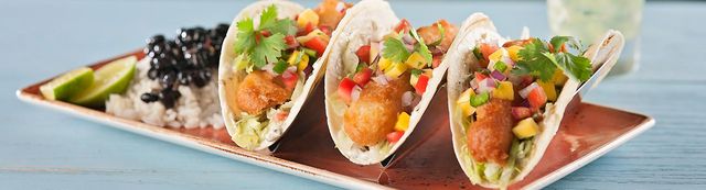 3 soft shell fish tacos with pico de gallo and a side of rice and beans