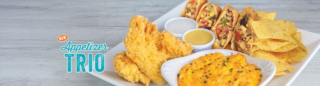 Appetizer Trio includes conch fritters, chicken tenders and buffalo chicken dip served with tortilla chips