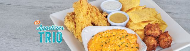 Appetizer Trio includes conch fritters, chicken tenders and buffalo chicken dip served with tortilla chips