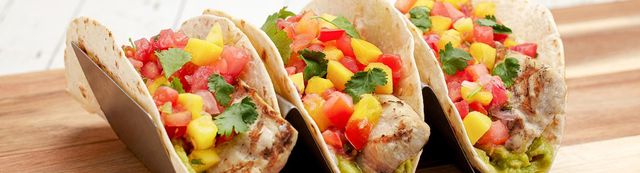Grilled Mahi wrapped in a flour tortilla. Served with black beans and white rice.jpg