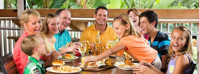 Family having fun together dining at Margaritaville Niargara Falls