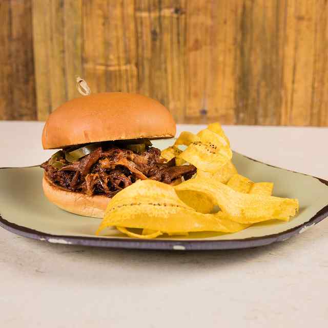 5 o'Clock Somewhere Aruba BBQ PORK SANDWICH Pulled pork, BBQ sauce, citrus coleslaw, jalapeños on brioche bun served with plantain chips