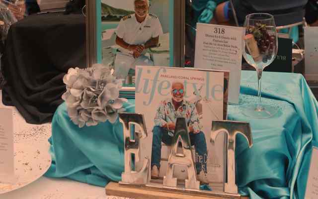 A runner touching the hands of other people with no faces showing