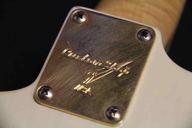 Ghost back of guitar with metal label Ghost back of guitar with metal label